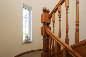 Stairwell with stained glass window at The Ferns