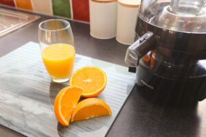 Fresh orange juice at The Ferns on Titanic cutting board